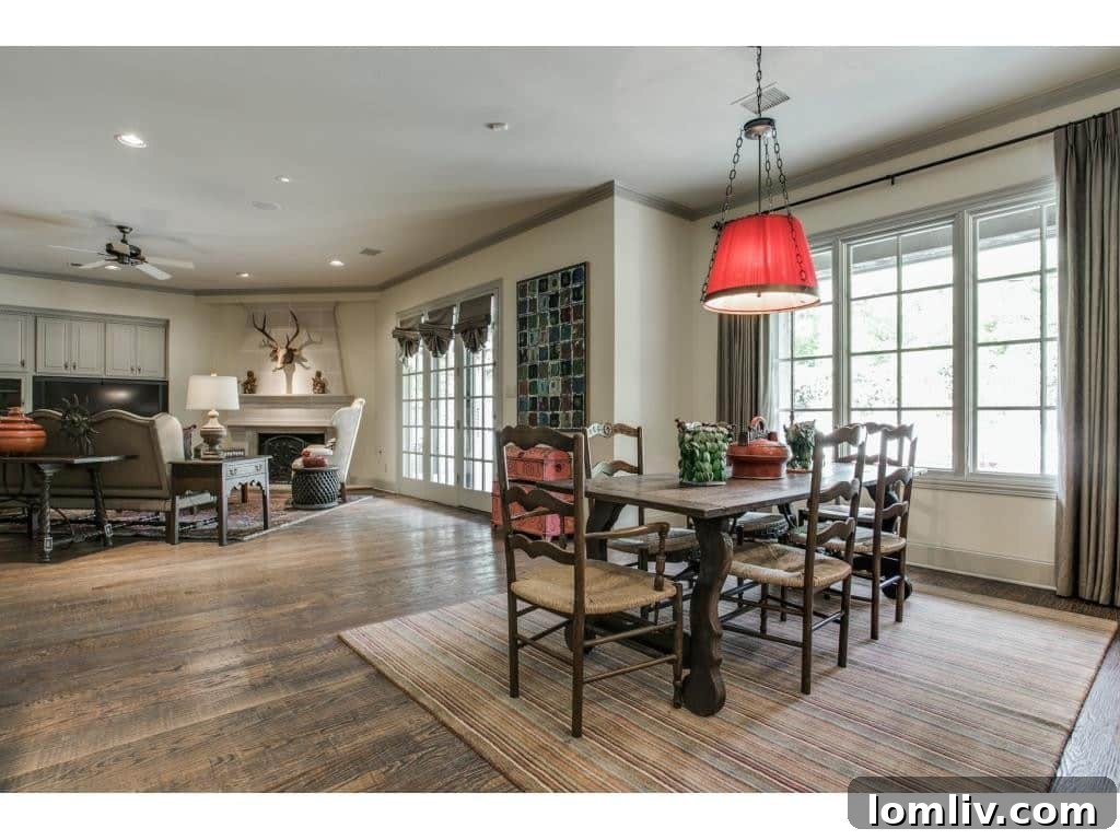 Luxurious dining room with ample space for entertaining, featuring elegant lighting