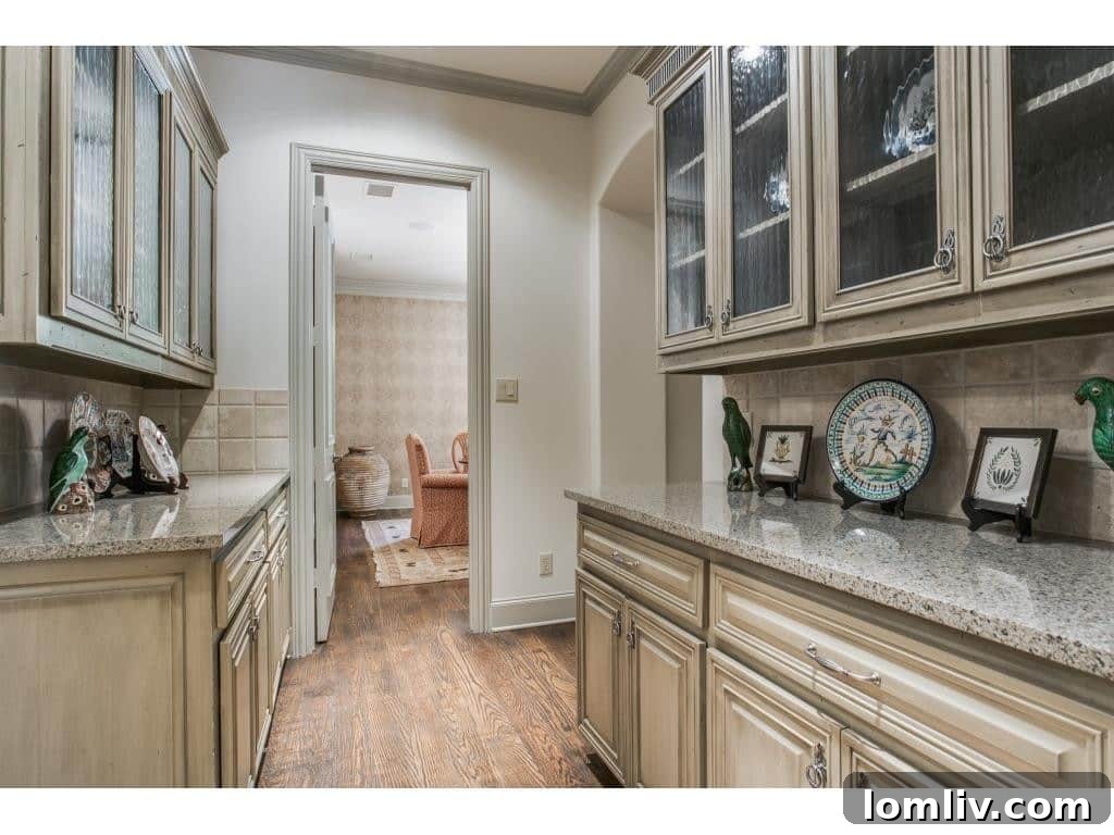 Elegant butler's pantry connecting the kitchen and formal dining area