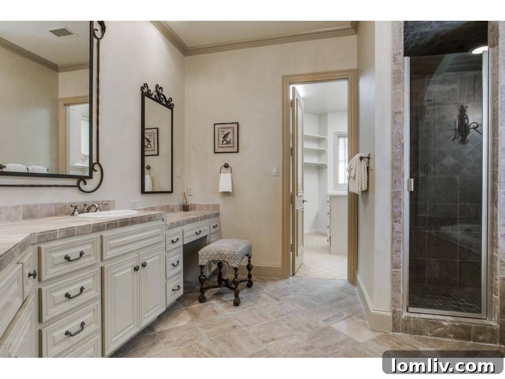 Elegant freestanding tub in the master bathroom, offering a serene retreat