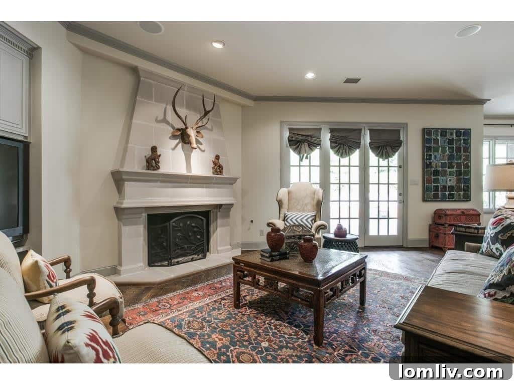 Gourmet kitchen with updated gray cabinetry, high-end appliances, and large island