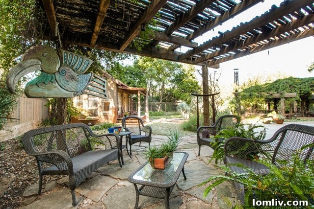 Inviting outdoor fireplace area, perfect for cozy evenings in this North Oak Cliff luxury home