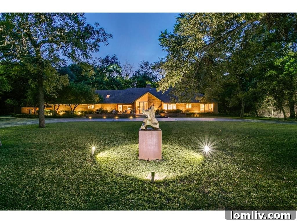 Front lawn with illuminated sculpture at 626 Rainbow Drive