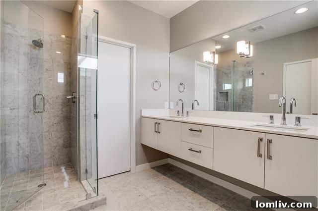 Luxurious bathroom with frameless shower and Carrera Marble accents.