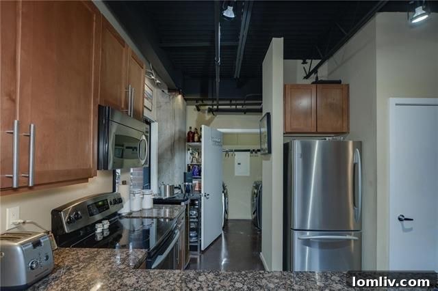 Modern Kitchen with Granite Countertops and Stainless Steel Appliances