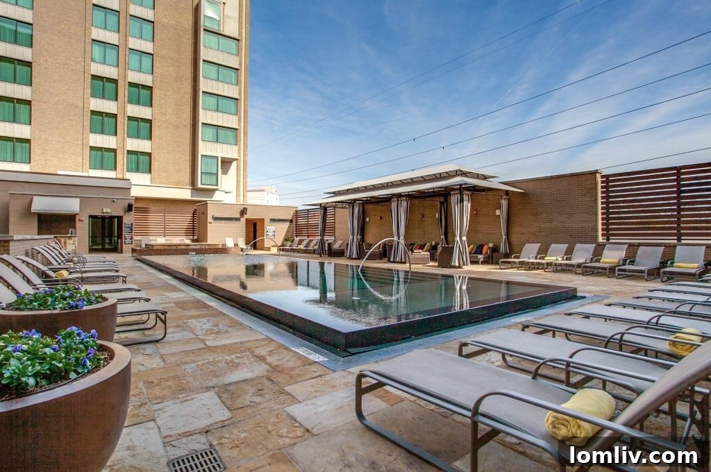Expansive living area with downtown Dallas and Highland Park views from unit 605