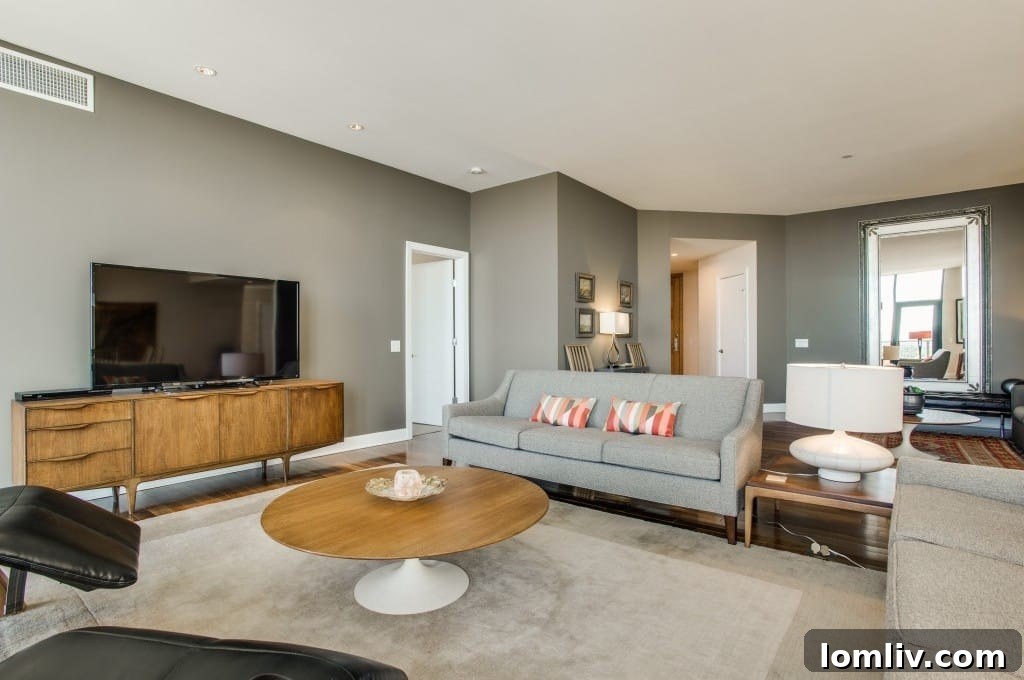Spacious living room with elegant furniture and large windows