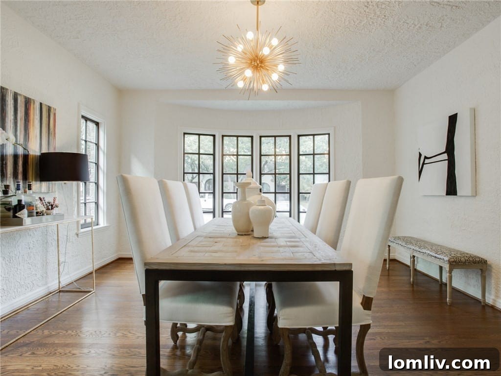Formal dining room with large bay window