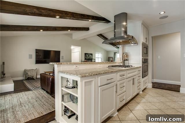 Park Forest Reno: Expansive 2,300+ SqFt with Open-Concept Living and Premium Amenities 12 Modern chef's kitchen featuring stainless steel double ovens and gas cooktop