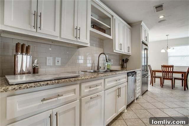 Park Forest Reno: Expansive 2,300+ SqFt with Open-Concept Living and Premium Amenities 13 Bright kitchen with fresh white cabinets and ample counter space