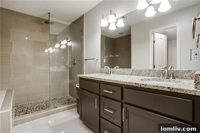 Park Forest Reno: Expansive 2,300+ SqFt with Open-Concept Living and Premium Amenities 17 Granite-topped dual sink vanity in the renovated master bathroom