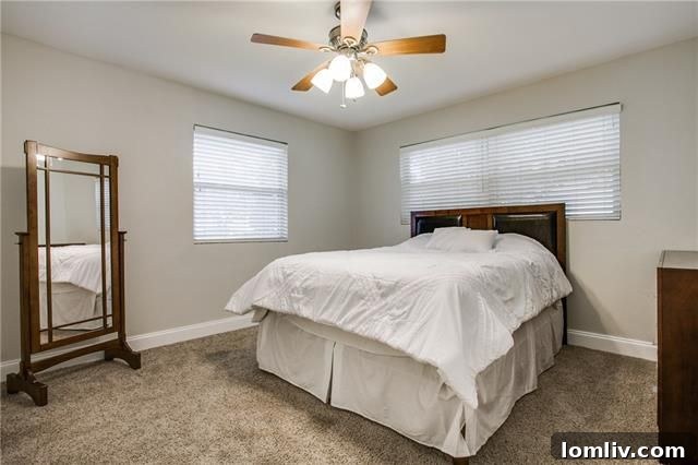 Park Forest Reno: Expansive 2,300+ SqFt with Open-Concept Living and Premium Amenities 19 Renovated secondary bathroom with modern fixtures and granite vanity
