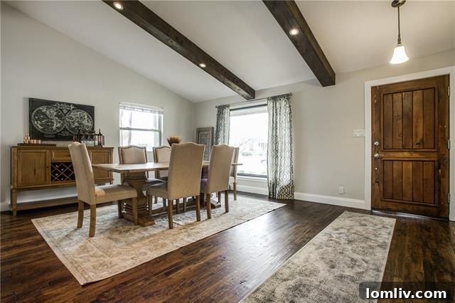 Park Forest Reno: Expansive 2,300+ SqFt with Open-Concept Living and Premium Amenities 5 Bright formal living area with vaulted ceilings, wood beams, and a custom fireplace at 3462 Flair Drive