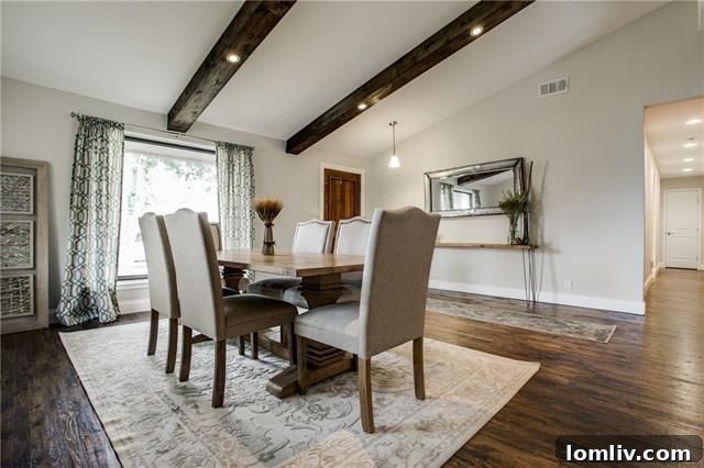 Park Forest Reno: Expansive 2,300+ SqFt with Open-Concept Living and Premium Amenities 7 Dining area adjacent to the living room, featuring modern light fixtures