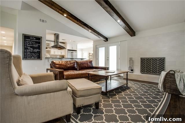 Park Forest Reno: Expansive 2,300+ SqFt with Open-Concept Living and Premium Amenities 9 Living room showcasing vaulted ceilings with exposed wood beams