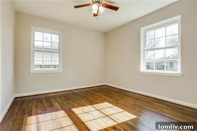 Another comfortable bedroom with fresh paint and excellent natural light.