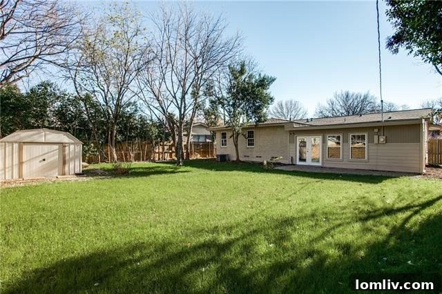 Completely renovated master bathroom with dual sinks, modern fixtures, and stylish floor tile.