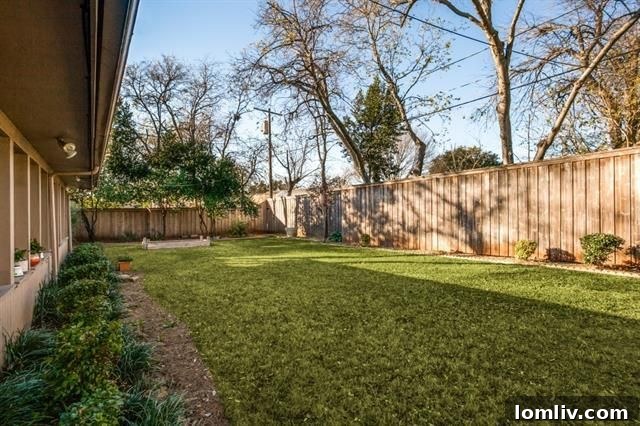 Beautifully landscaped garden area with raised bed