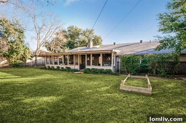 Full view of the private backyard with board-on-board fence