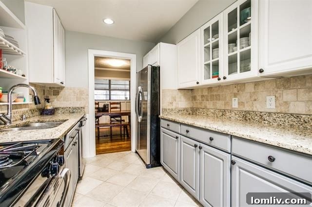 Kitchen details featuring travertine tile backsplash