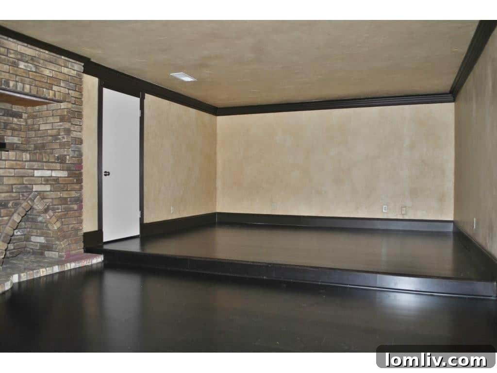 Elegant fireplace with a stone surround in a main living area, adding warmth and sophistication.