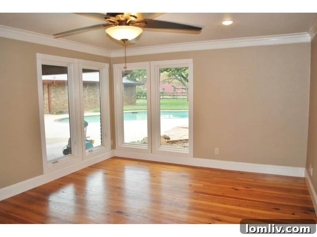 Beautiful outdoor swimming pool area with a spacious patio, ideal for relaxation and entertaining.