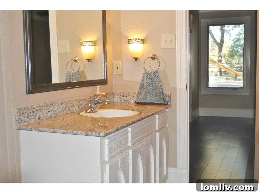 Spacious secondary bathroom with modern fixtures and finishes.
