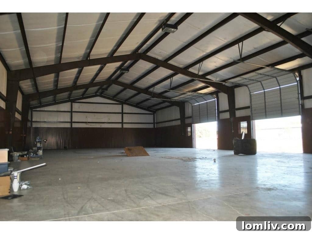 Exterior view of a barn structure on the property, indicating agricultural or equestrian use.
