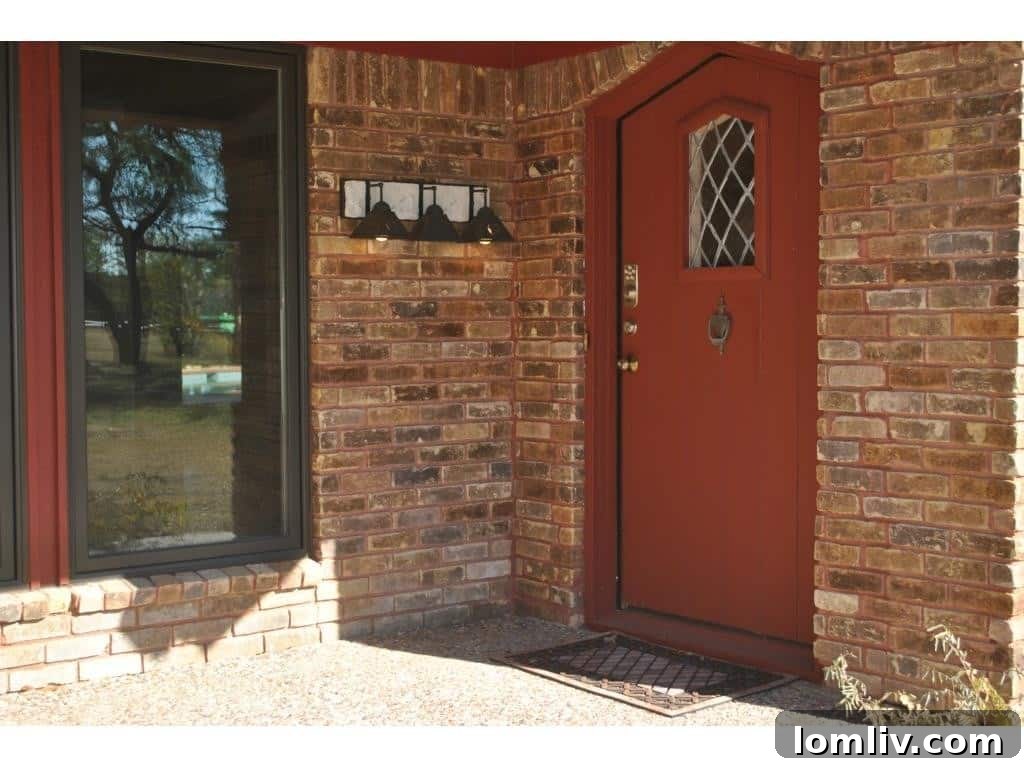 Close-up of the distinctive red Feng Shui front door of the Couch residence, signifying personal touches.