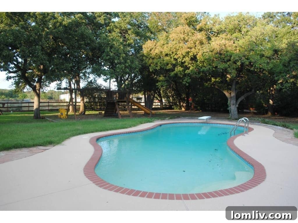 Closer view of the swimming pool and patio area, designed for outdoor enjoyment and entertainment.