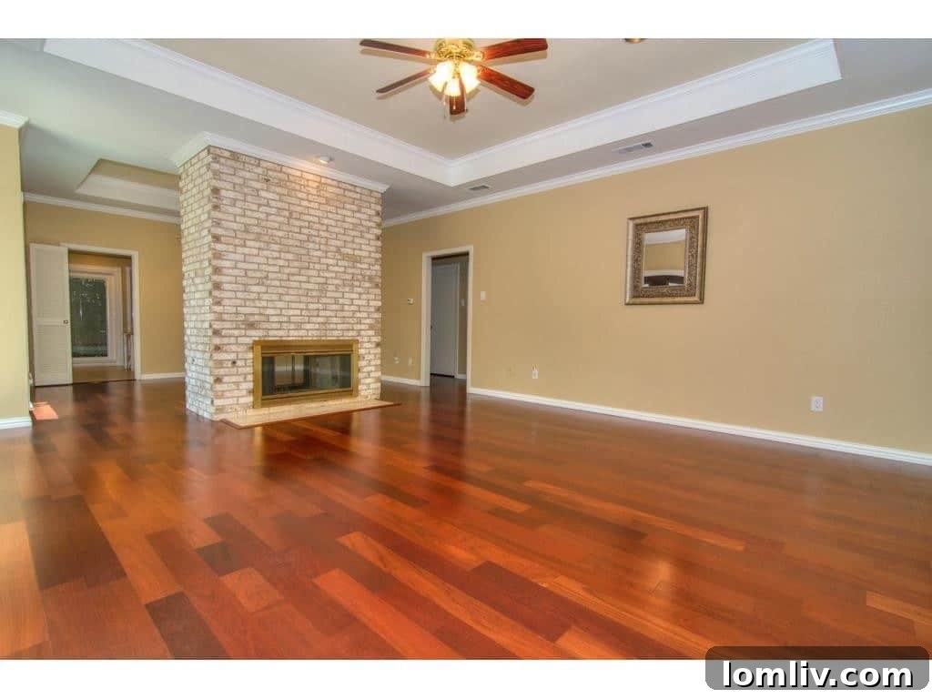 Cozy living area with a brick fireplace at 18605 Crownover Court, perfect for gatherings.