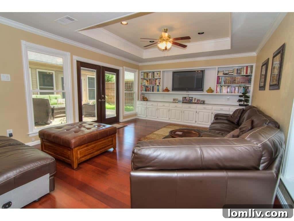 Spacious main living room at 18605 Crownover Court, showcasing new hardwood floors and ample natural light.