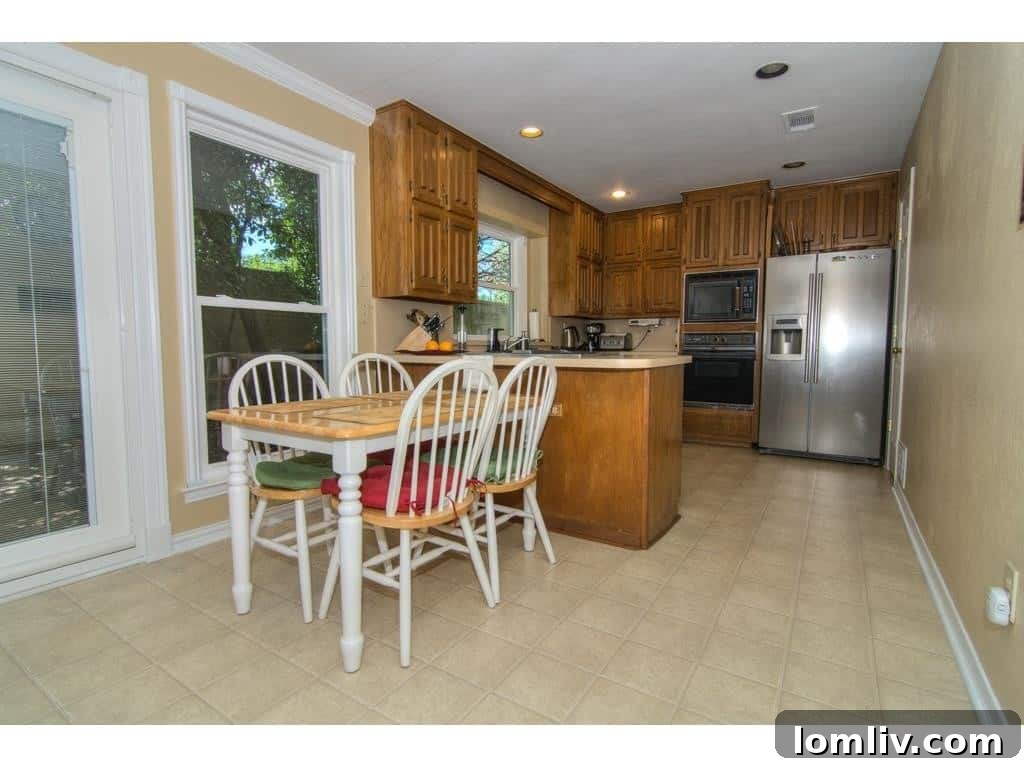 Eat-in kitchen area at 18605 Crownover Court, showing potential for modernization.