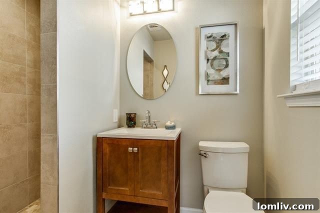 Another view of the elegant granite countertops and modern sink in the kitchen