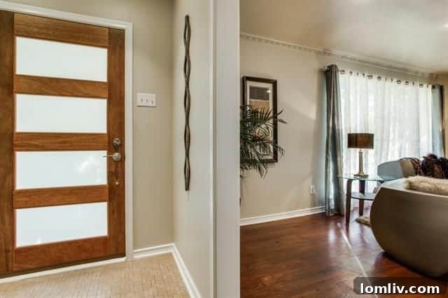 Spacious living room with hardwood floors and recessed lighting in 8335 Banquo Dr