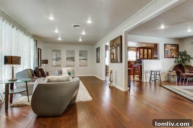 Family room view from the living room, showing the open floorplan at 8335 Banquo Dr