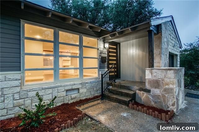 3930 Beechwood Lane - Inviting blue exterior with natural stone and wood siding