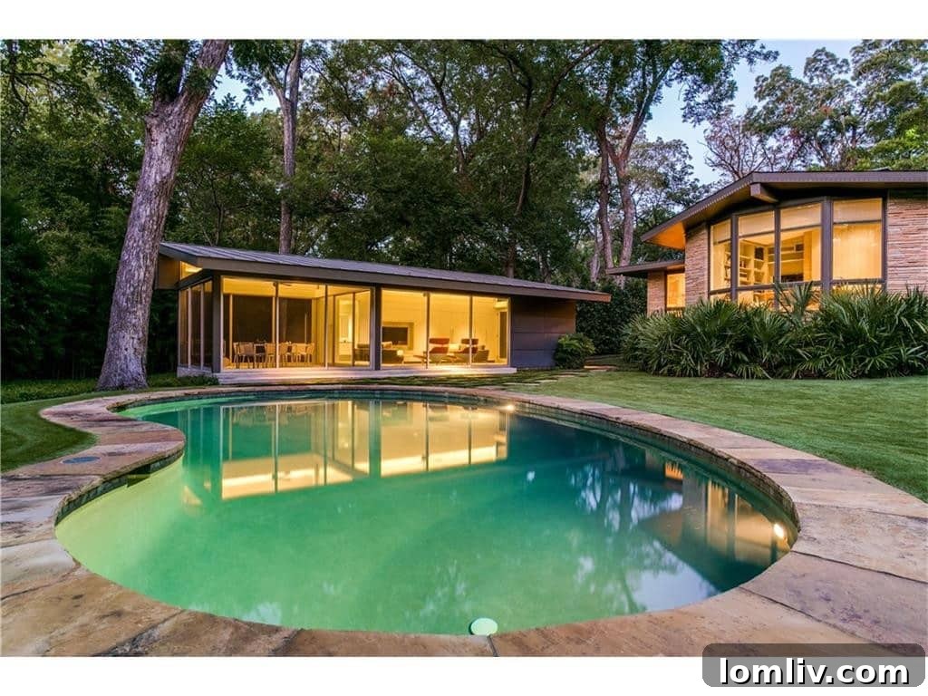 Inviting Swimming Pool with Lush Landscaping in a Private Dallas Home