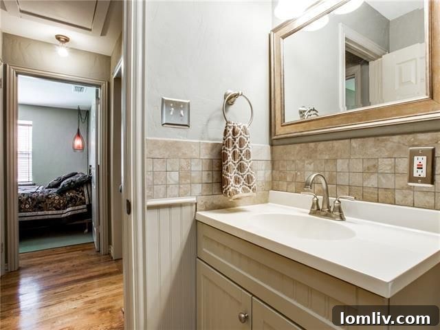 Updated bathroom with new sink, vanity, and fixtures