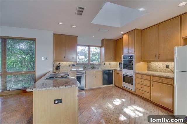 Spacious master bedroom with fireplace and sitting area