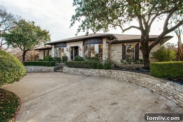 Crisp white exterior of the updated ranch at 9644 Robin Meadow Dr