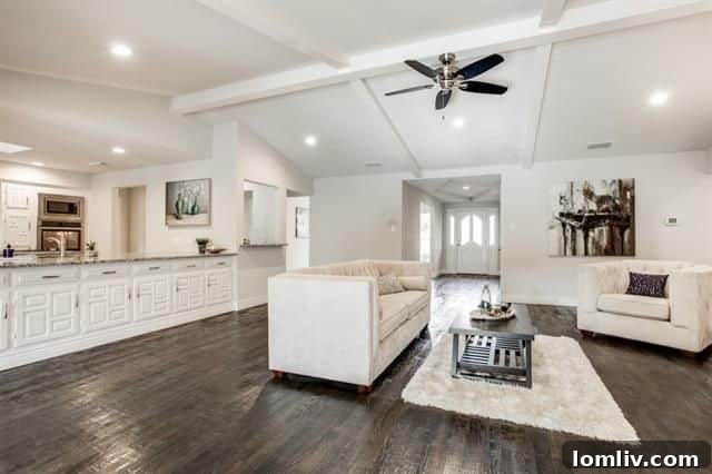 Open concept living room with handscraped hardwood floors