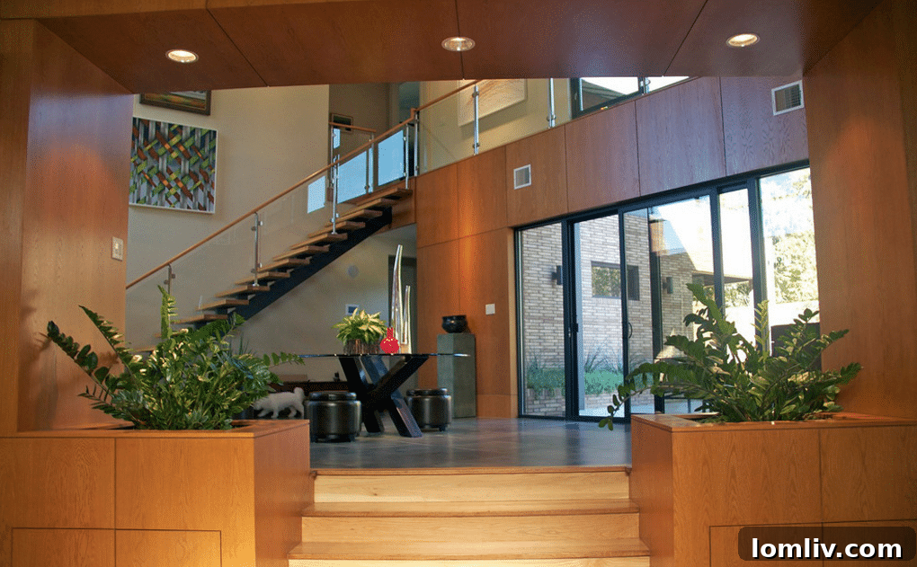 Exterior shot of a modern, multi-story Dallas home with a minimalist facade and clean lines.