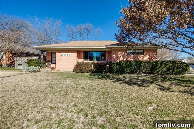 Exterior view of 10655 Longmeadow Dr with mid-century brick and mature trees