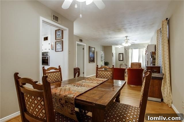 View of the pink brick fireplace in the second living room at 10655 Longmeadow Dr