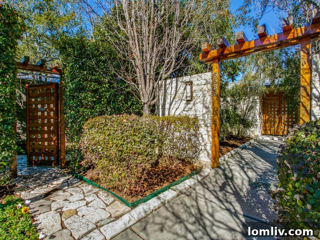 Casa Verde entrance with unique round driveway and lush landscaping.
