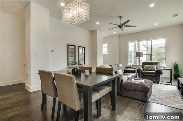 Bright, open-concept living area with custom hardwood flooring and contemporary fixtures