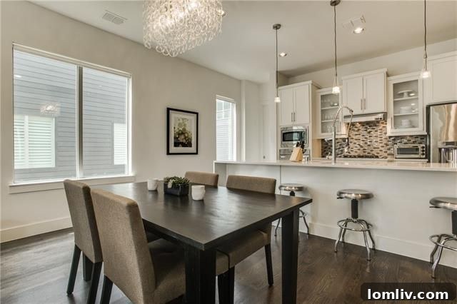 Modern kitchen with quartz island, stainless steel appliances, and gas cooktop