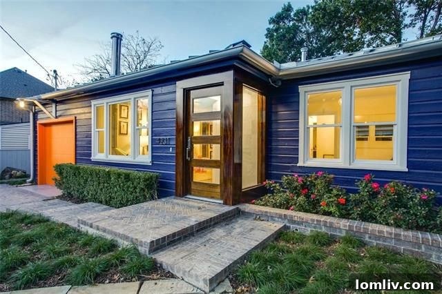 Colorful blue and orange exterior of a renovated ranch home in Northwest Dallas