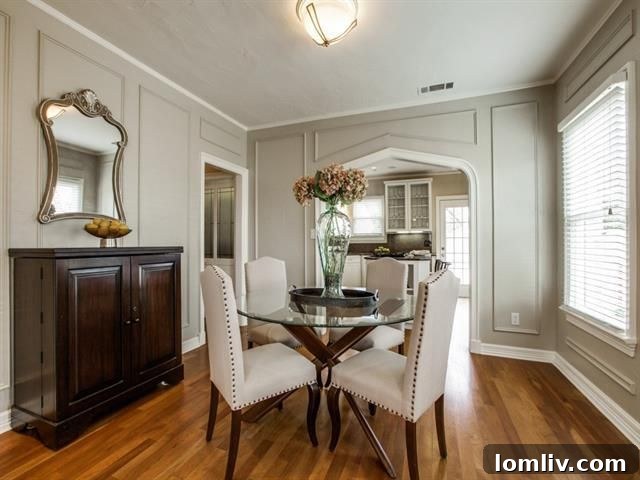 Warm and inviting living room with original fireplace and arched doorways in a Hollywood/Santa Monica Tudor