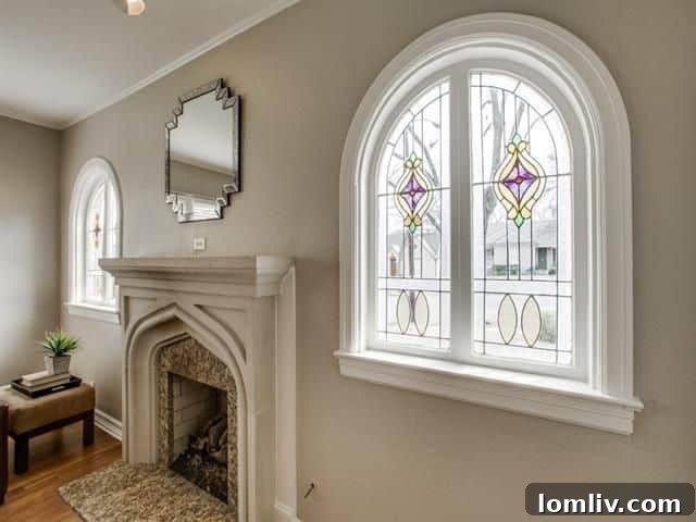 Updated kitchen with large gas cooktop, granite countertops, and ample cabinetry